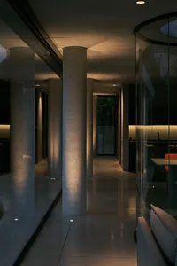 A modern interior featuring a concrete space with concrete columns and walls.