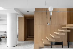 A modern minimalist interior design with wooden elements and a minimalist aesthetic.
