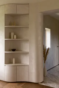 Modern interior design featuring a sandstone storage cabinet with minimalist design.