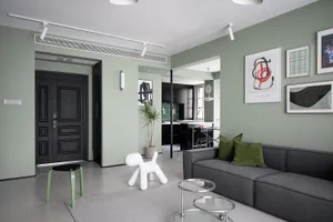 Modern residential interior with concrete, glass, and metal elements.