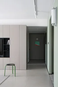 Modern residential hallway with minimalist design and painted cement subfloor.