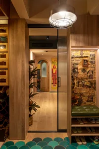 Industrial-style corridor with wooden walls, paper art, and metallic details.