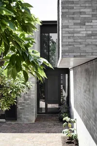 Concrete residential entrance with minimalist design elements.
