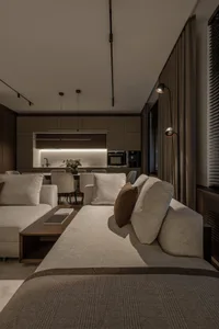 A minimalist living room with comfortable sofas and modern furnishings.