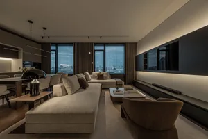 Modern living room featuring neutral-toned furniture and minimalist design.