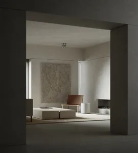 Modern minimalist living room featuring minimalist furniture and concrete surfaces