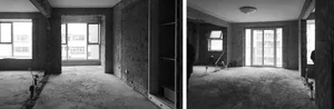 An empty apartment undergoing renovation with concrete walls and floors, featuring exposed beams and windows.