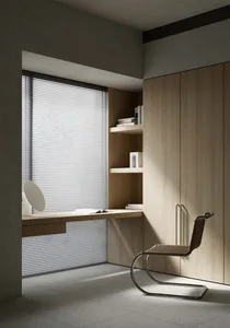 A modern home office featuring wooden cabinets and good lighting.