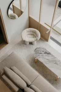 Modern living room features concrete and marble materials