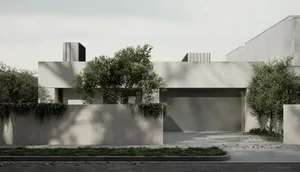 A modern residential exterior with concrete walls and a minimalist design.