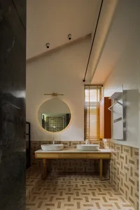 Modern bathroom featuring ceramic tiles with a geometric pattern