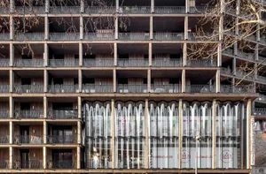 Modern building with metallic balconies and glass facade