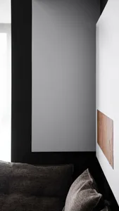 Modern glass corner with concrete accents in contemporary interior design