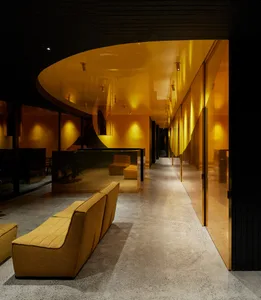 An interior office space featuring modern, sleek design with glass walls.