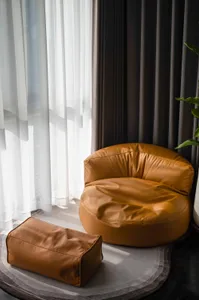 Tan-colored, casual-style chairs made of leather material.