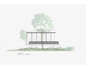 Modern exterior of a house with glass and steel facade, surrounded by greenery and trees.