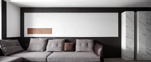 Modern living room with grey fabric sofas, grey cushions, and a minimalist design.