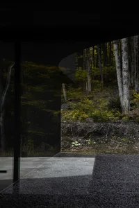 A minimalist modern architectural design featuring a glass window.