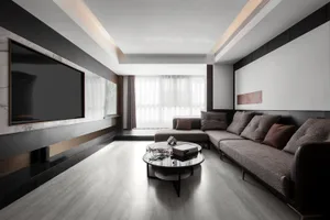 A minimalist living room with concrete flooring, a leather sofa, and marble accents.