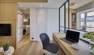 A modern office space with a wooden desk, glass partition, and minimalist design elements.