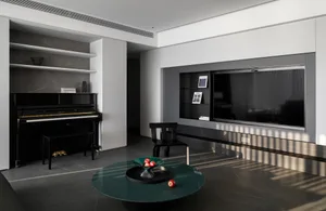A modern minimalist living room with marble flooring, black furniture, and a piano.
