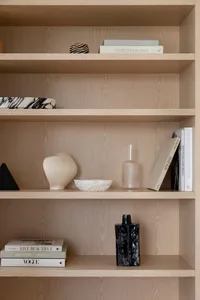 Wooden shelves with decorative items and books
