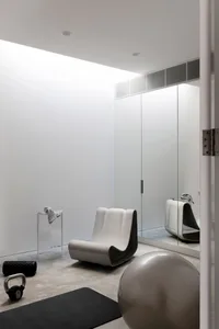 Modern minimalist home gym with concrete decor elements