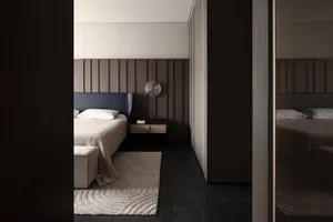 Contemporary bedroom featuring minimalist furniture and wooden paneling for a stylish and comfortable living space.