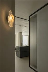 Modern minimalist house interior designed with black marble kitchen counter and glass doors.