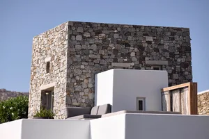 A minimalist building with stone exteriors featuring clean lines and a simple aesthetic.
