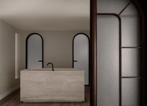 Modern minimalist bathroom featuring a rectangular marble tub with a sleek faucet and minimalist fixtures.