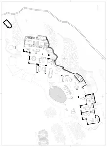 Black and white architectural drawing of a modern residential floor plan showing various rooms and layouts.