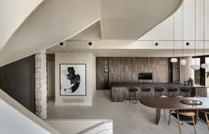 A modern residential kitchen with wooden surfaces and a central island