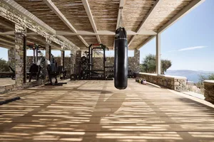 A minimalist fitness center with a floating platform.