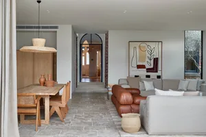 Interior design of a modern living room with wooden and concrete materials