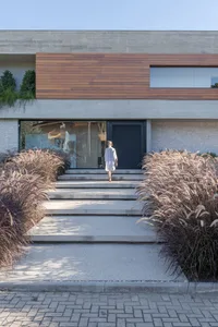 A modern house with concrete and glass features.