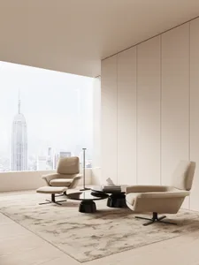A minimalist living room featuring a modern, neutral-colored design with sleek, comfortable furniture, a large window with a 