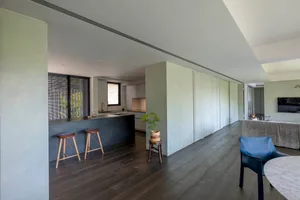 An image showing a modern interior with concrete and wooden materials.