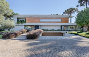 Modern residential home with concrete, glass, and wood materials