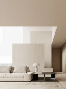 A minimalist living room featuring neutral-tones furniture and decor.