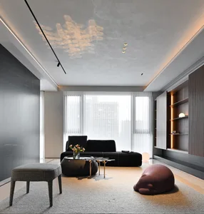 Comfortable minimalist living room with modern furniture and neutral tones.
