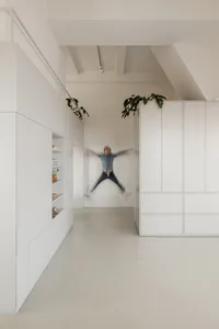 A minimalist white interior space with clean lines and modern design elements.