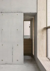 Modern interior with concrete walls and minimalist design elements.