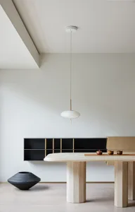 A modern dining area featuring wood elements and minimalist design.