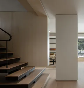 A modern interior staircase made of wood.