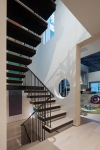 Modern interior design featuring wood, concrete, and black materials