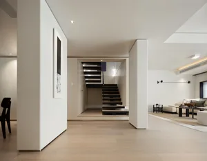 Modern living room with a wooden floor and white walls, featuring stylish furniture and a minimalist design.