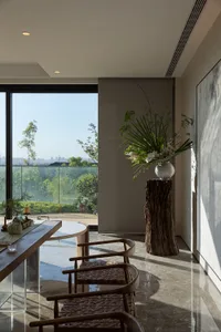 Modern living room featuring marble, wood, and glass materials