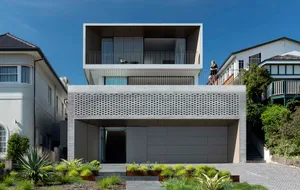 Modern, rectangular concrete architectural object with a flat roof and minimalist design.