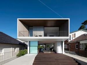 A modern house featuring glass, metal, and concrete materials.